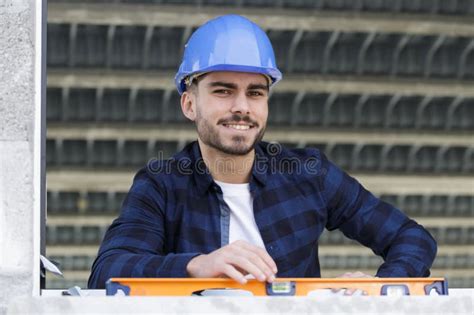 Worker Inspecting Window Sill Using Builders Level Stock Photo Image