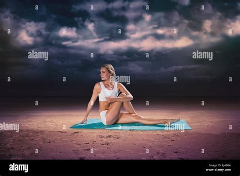 Composite Image Of Gorgeous Fit Blonde In Seated Yoga Pose Stock Photo
