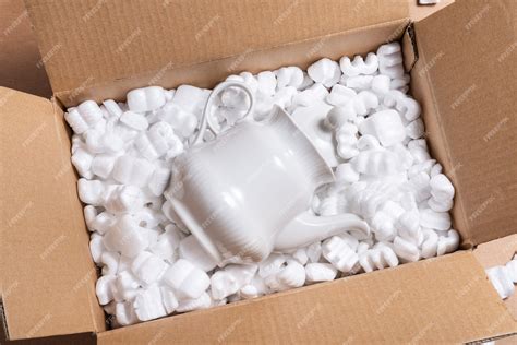 Premium Photo Cardboard Box On Loose White Filler Shipping Packing Peanuts