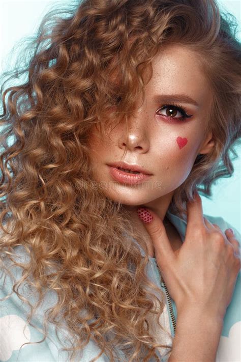 Pretty Girl With Curls Hairstyle Classic Makeup Freckles Nude Lips Beauty Face Stock Photo