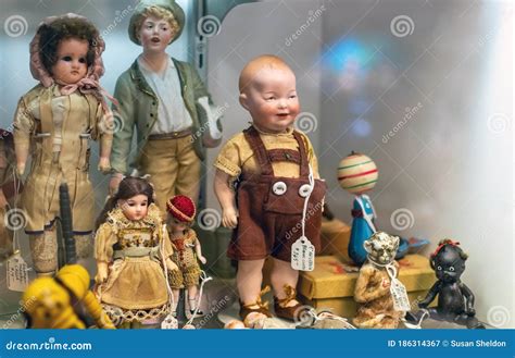 Display Of Antique Dolls At An Antique Shop Editorial Photography