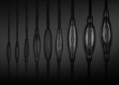 A group of black headphones on a black background.