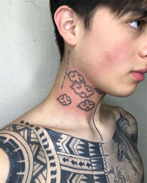 A Man With Tattoos On His Neck And Chest