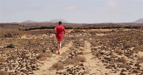 Running Man Male Runner On Desert Road Running Fast In Red Running