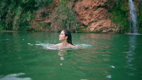 Naked Model Swimming Cliff Lake In Beautiful Summer Nature Woman