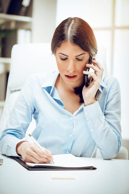 Premium Photo Successful Young Woman Working At Her Desk In The