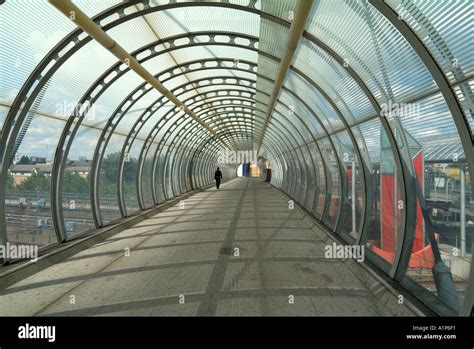 Pedestrian Footbridge Inside Translucent Steel Framed Tubular Tunnel