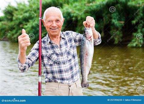 Fisherman Holding Fresh Catch Fish Stock Image Image Of Bait Mature