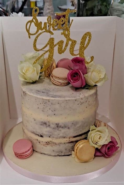 Semi Naked Celebration Cake With Macarons And Fresh Flowers