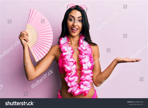 Beautiful Hispanic Woman Wearing Bikini Holding Stock Photo