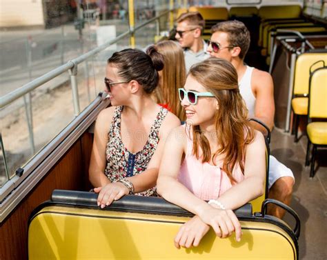 Group Of Smiling Friends Traveling By Tour Bus Stock Image Image Of