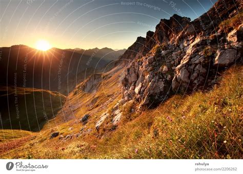 gold sunrise in mountains during summer - a Royalty Free Stock Photo ...