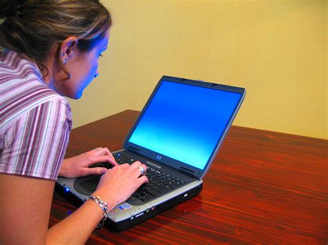 Filewoman Typing On Laptop