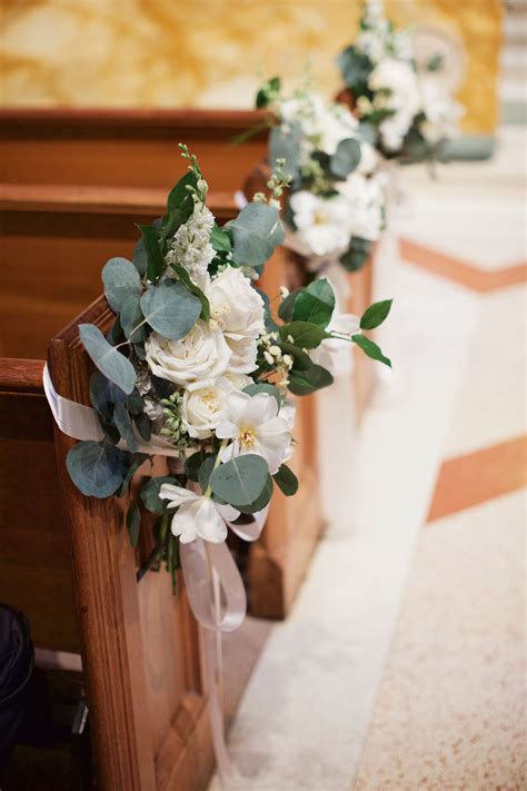 Cathedral Is Set For The Wedding With Pew Markers Of White Roses White