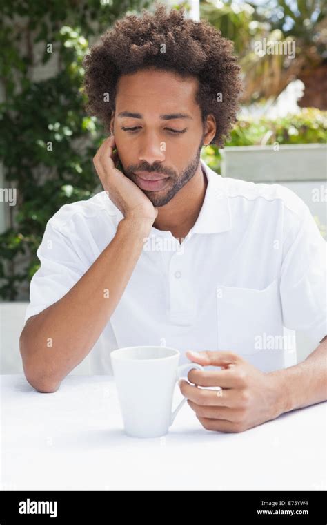 Thoughtful Man Having A Coffee Stock Photo Alamy