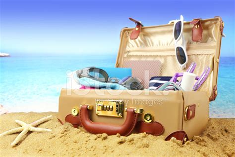 Full Open Suitcase On Tropical Beach Background Stock Photo Royalty