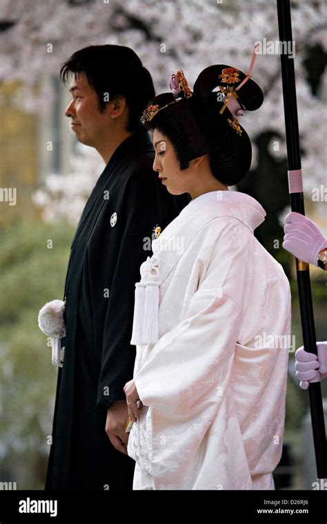 A Married Couple Wears Traditional Japanese Wedding Kimonos At