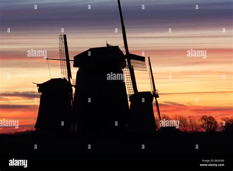 Windmills At Sunrise Stock Photo Alamy
