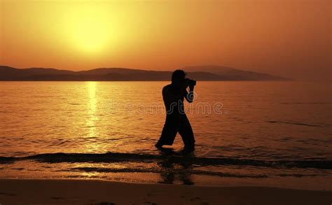 Photographer at Sunset on the Beach Stock Photo - Image of outdoor ...