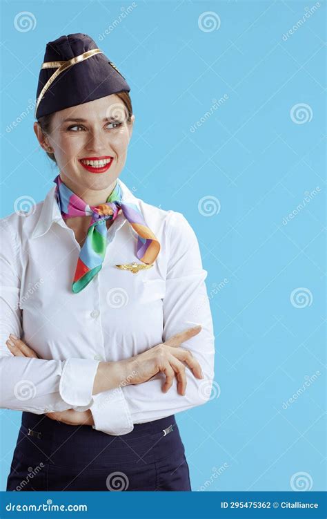 Smiling Elegant Flight Attendant Woman On Blue Looking Aside Stock