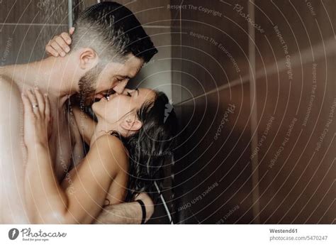 Romantic Couple Lying On Jetty Kissing A Royalty Free Stock Photo