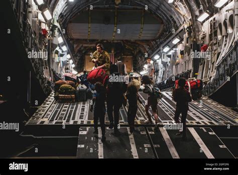 Evacuees Board A Boeing C 17 Globemaster Iii During An Evacuation At Hamid Karzai International