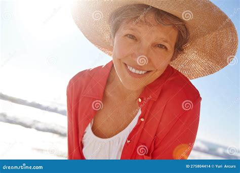 Another Perfect Day In Paradise Portrait Of An Attractive Mature Woman Enjoying A Day At The