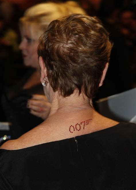 Dame Judi Dench sports 007 tattoo at the premiere of the new James Bond ...