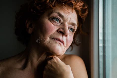 Mature Woman By The Window Thinking About Life Stock Photo Image Of
