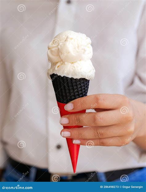 Woman S Hand Holds Vanilla Ice Cream In Cone Stock Image Image Of