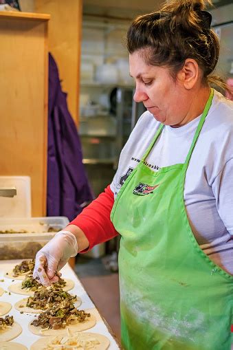 Woman Making Traditional Russian Piroshki At The Piroshki Piroshki