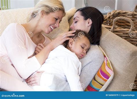 Same Sex Couple Cuddling Their Baby Son Stock Image Image Of Holding Offspring