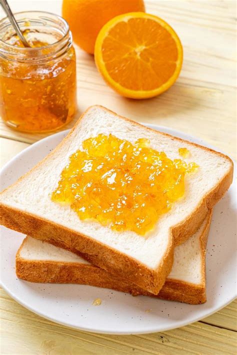 Slices Of Bread With Orange Jam 6686885 Stock Photo At Vecteezy