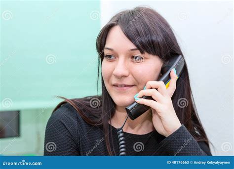 Attractive Woman Talking On Phone In Office Stock Image Image Of