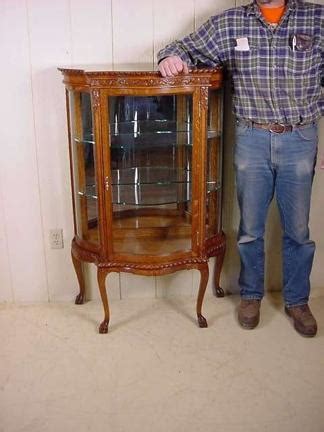 SERPENTINE GLASS OAK CURIO CABINET Doug Schmitt Antiques