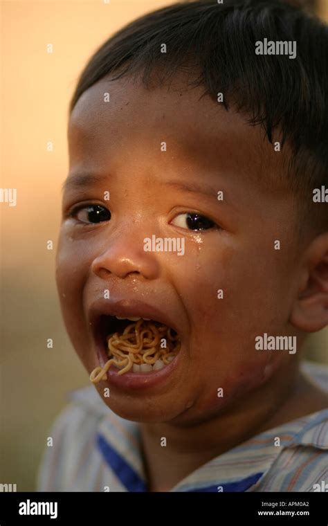 young boy mouth open crying with noodles Stock Photo - Alamy