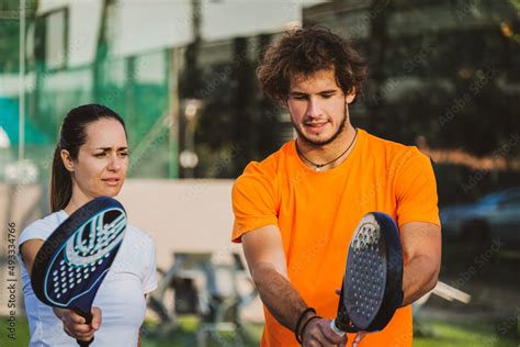 Young Teacher Is Monitoring Teaching Padel Lesson To His Student