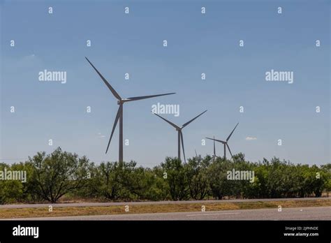 Modern West Texas Vista In The Summer With Wind Turbines In The Desert