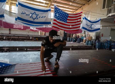 Chomein Iran 27th Oct 2023 An Employee Of A Flag Factory Works On A