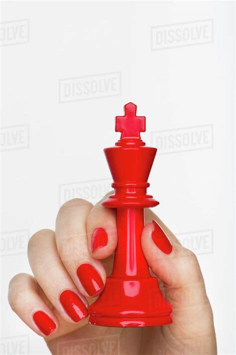 Hand Holding Red King Chess Piece Stock Photo Dissolve