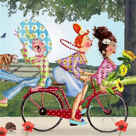 Two Women Riding On A Bicycle With Flowers And An Umbrella