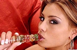 Anetta Keys Strips On A Red Couch And Plays With A Glass Dildo