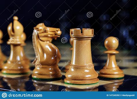 Chess Pieces Rook Knight Bishop And Pawn On Chess Board Stock Photo