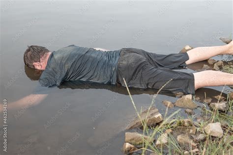 The Body Of A Man Who Drowned Lying Face Down In The Water Lifeless