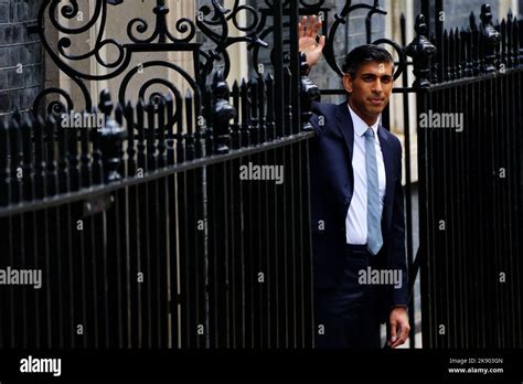 Rishi Sunak waves from the door of 10 Downing Street, London, after ...