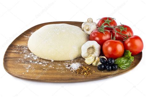 Pizza dough with ingredients — Stock Photo © bakerjim #11487624