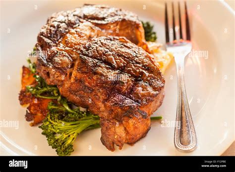 Grilled Rib Eye Steak With Roasted Potatoes Garlic Confit And Avocado