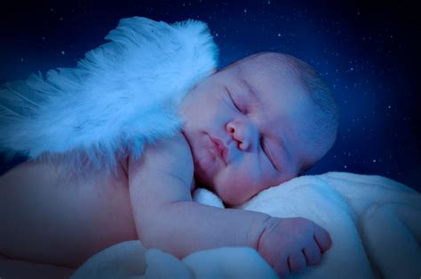 Premium Photo Side View Of Cute Naked Baby With Wings Sleeping On Bed