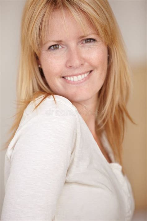 Shell Win Over Your Heart A Beautiful Mature Woman Smiling At The