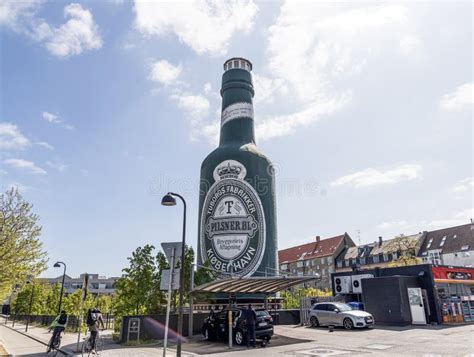 Tuborg Beer Bottles On Shelves In A Supermarket Buyer Takes Tuborg